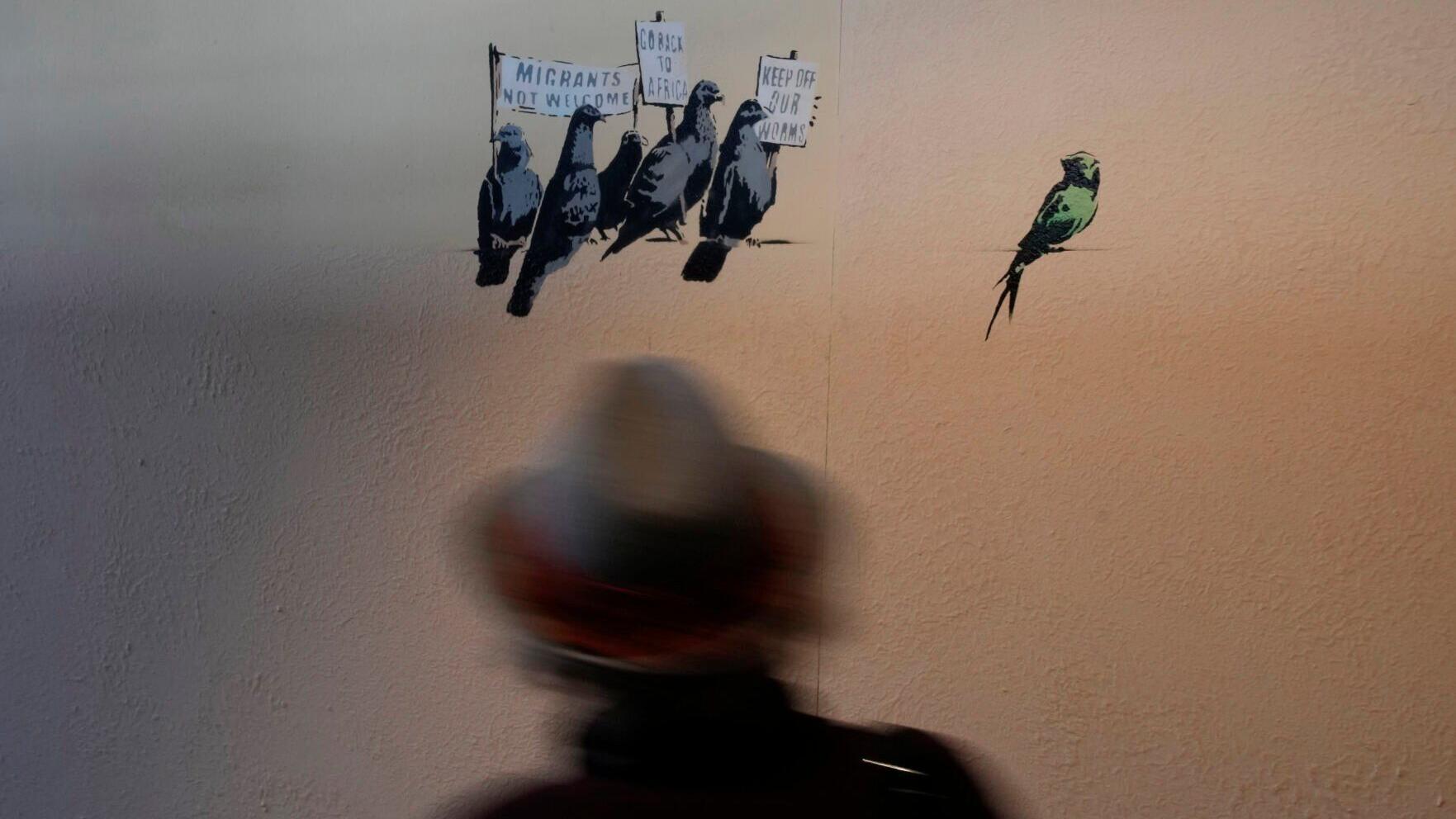 Photos: Banksy street murals recreated in Milan's main train station